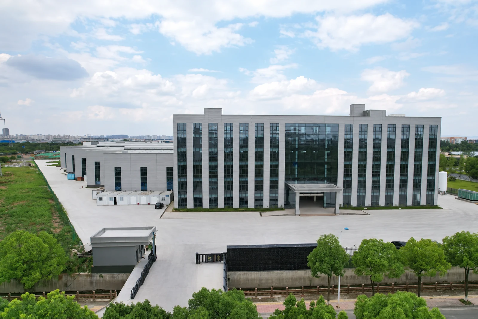 Exterior of a manufacturing partner facility, with office building and adjoining factory workshops